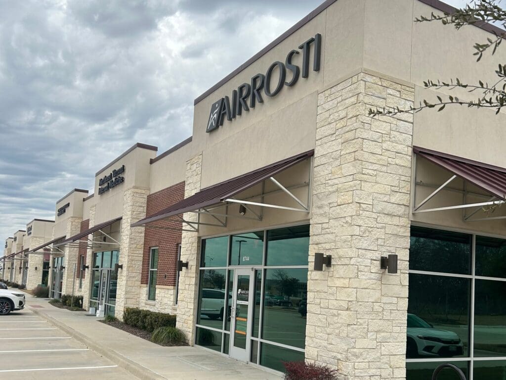 Exterior and angled view of the entrance at Airrosti Alliance