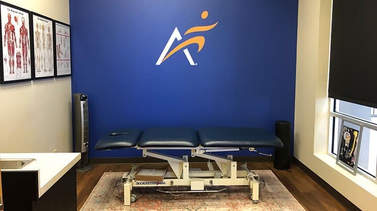 The treatment room at Airrosti Alon Market where patient's will undergo a physical assessment to have their issues identified and treated.