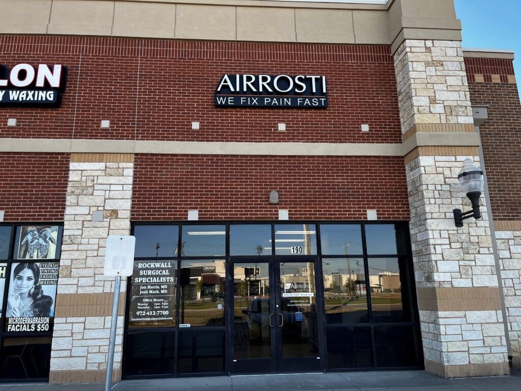 An exterior view of the entrance of Airrosti Forney, showcasing the Airrosti Logo