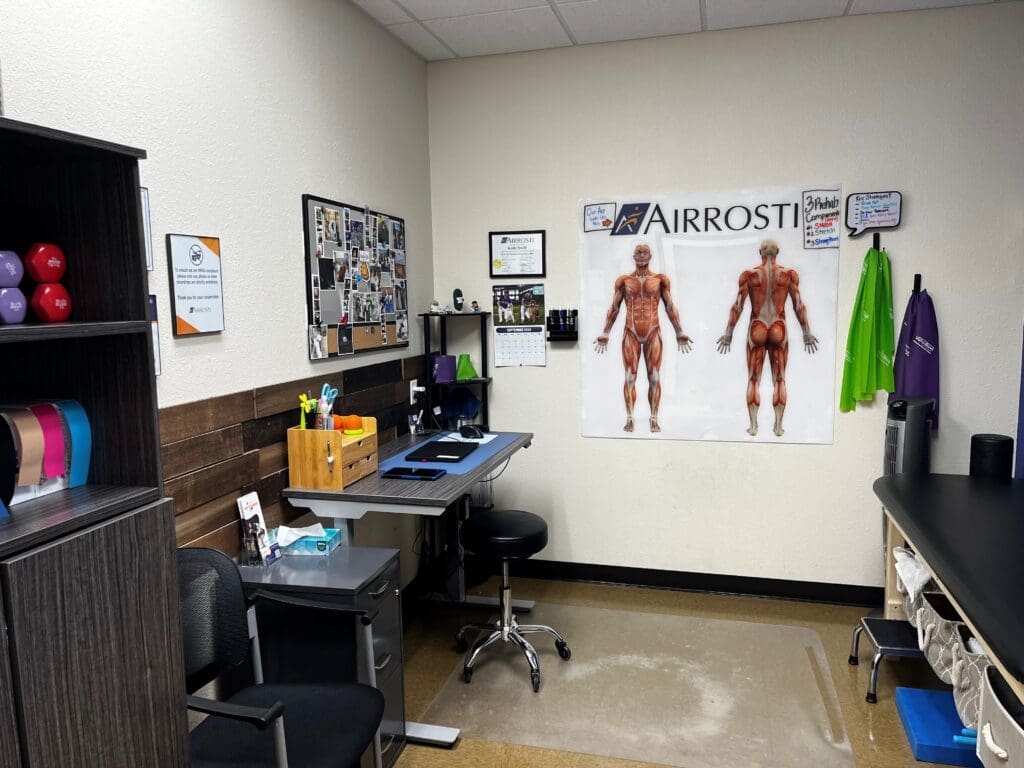 a photo of the recovery room at Airrosti Forney. The MSK diagram posters are displayed on the back wall.