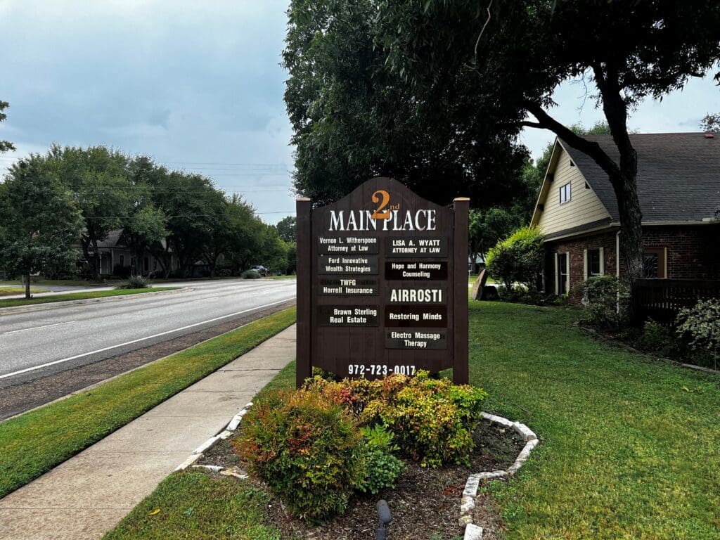 an exterior photo of the building and marquis where Airrosti Main Place is located.