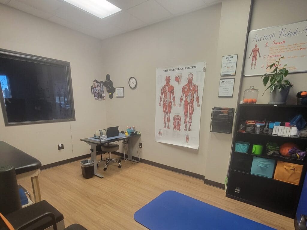 recovery room at Airrosti Richardson with MSK diagram on wall