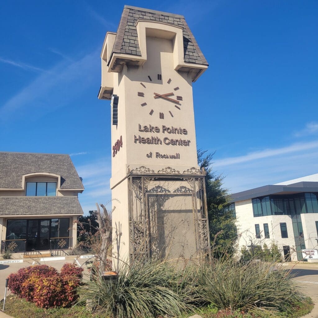 The exterior view of the clocktower at Airosti Rockwall. View from the street.