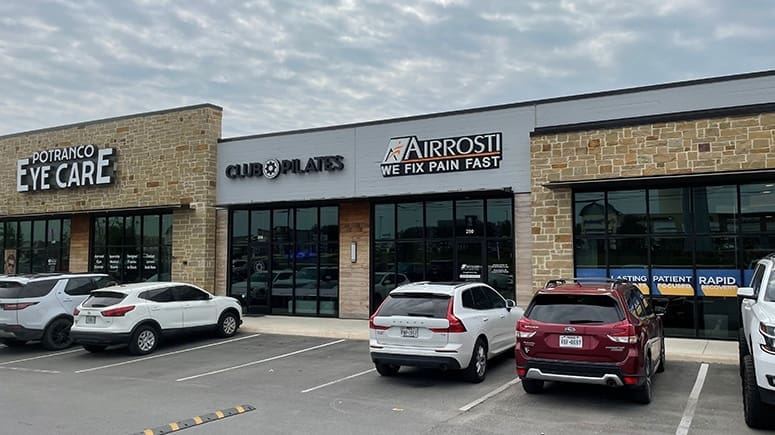 The building exterior of Airrosti Stevens Ranch in San Antonio, TX