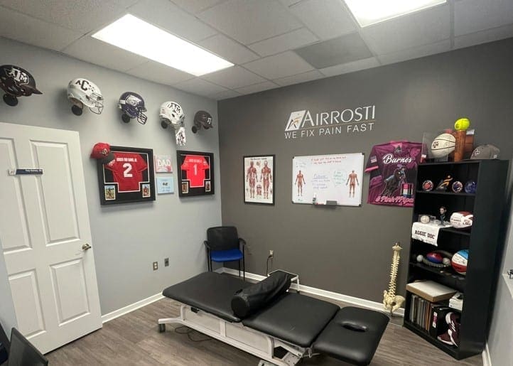 Airrosti University_Treatment_Room with A&M helmets