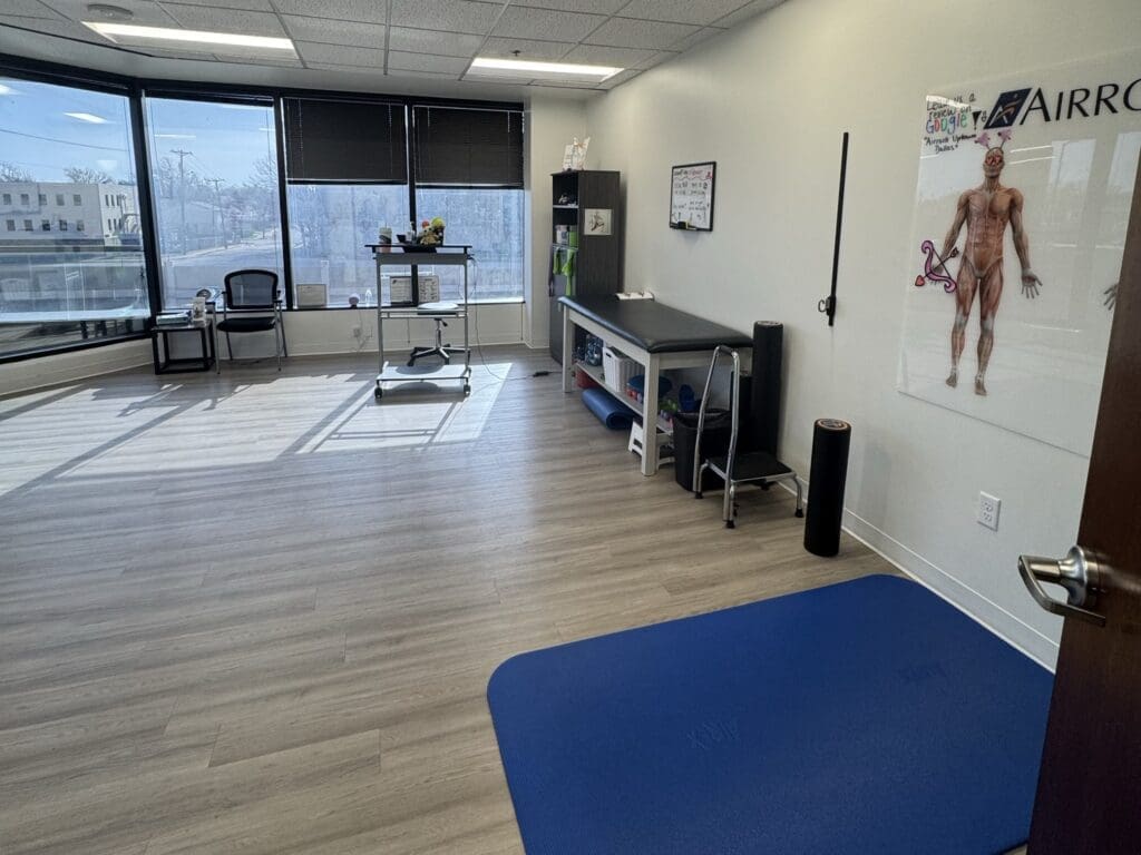 Recovery room at Airrosti Uptown Dallas. Exercise mat shown on floor.