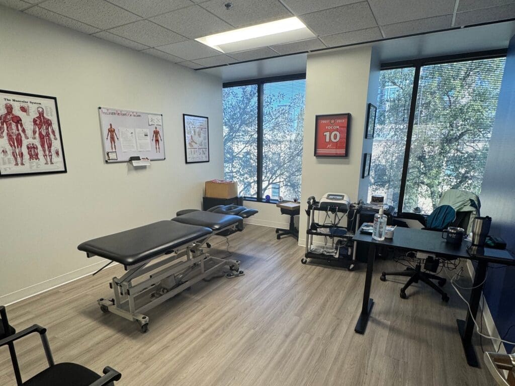 Treatment room at Airrosti Uptown Dallas. Treatment table is featured.