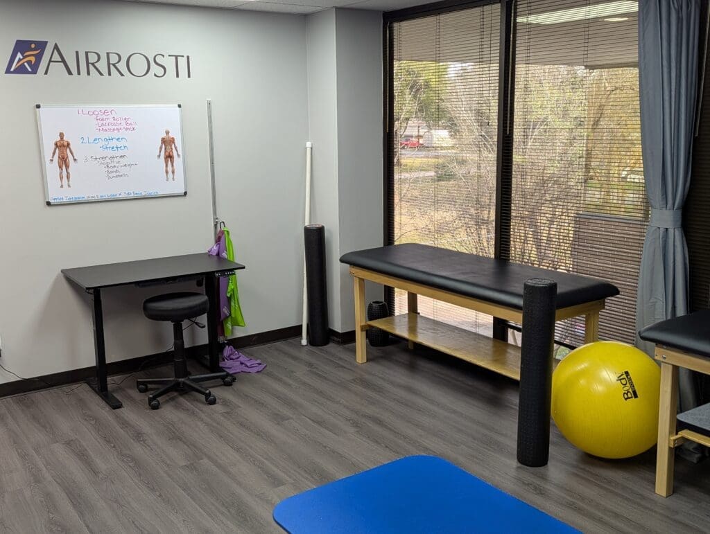 Recovery room at Airrosti Tomball. Exercise mat visible.