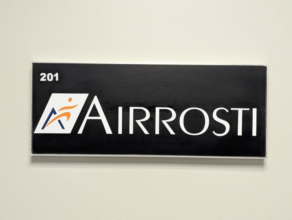 Airrosti sign at the interior entrance of Airrosti Tomball