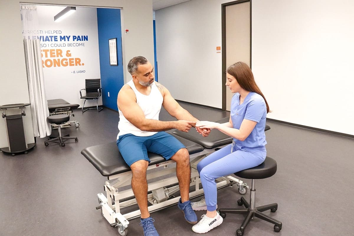 Airrosti Provider working on patient with wrist pain