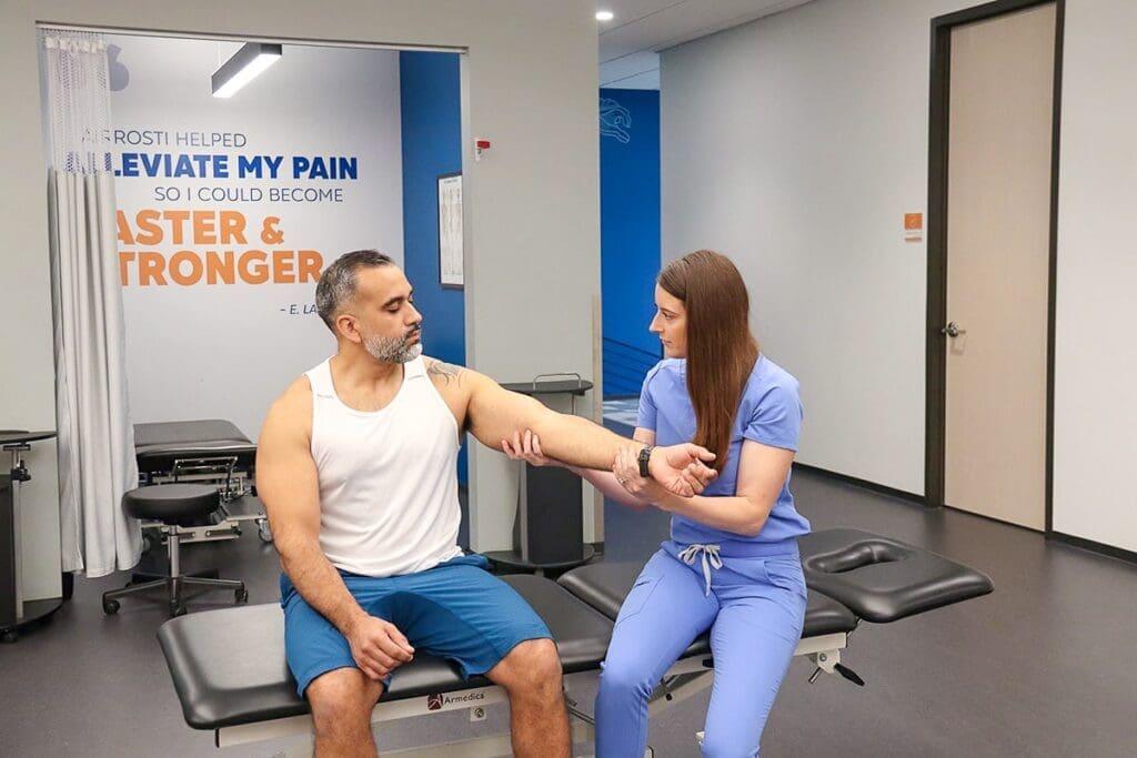 Airrosti Provider treating patient with tennis elbow