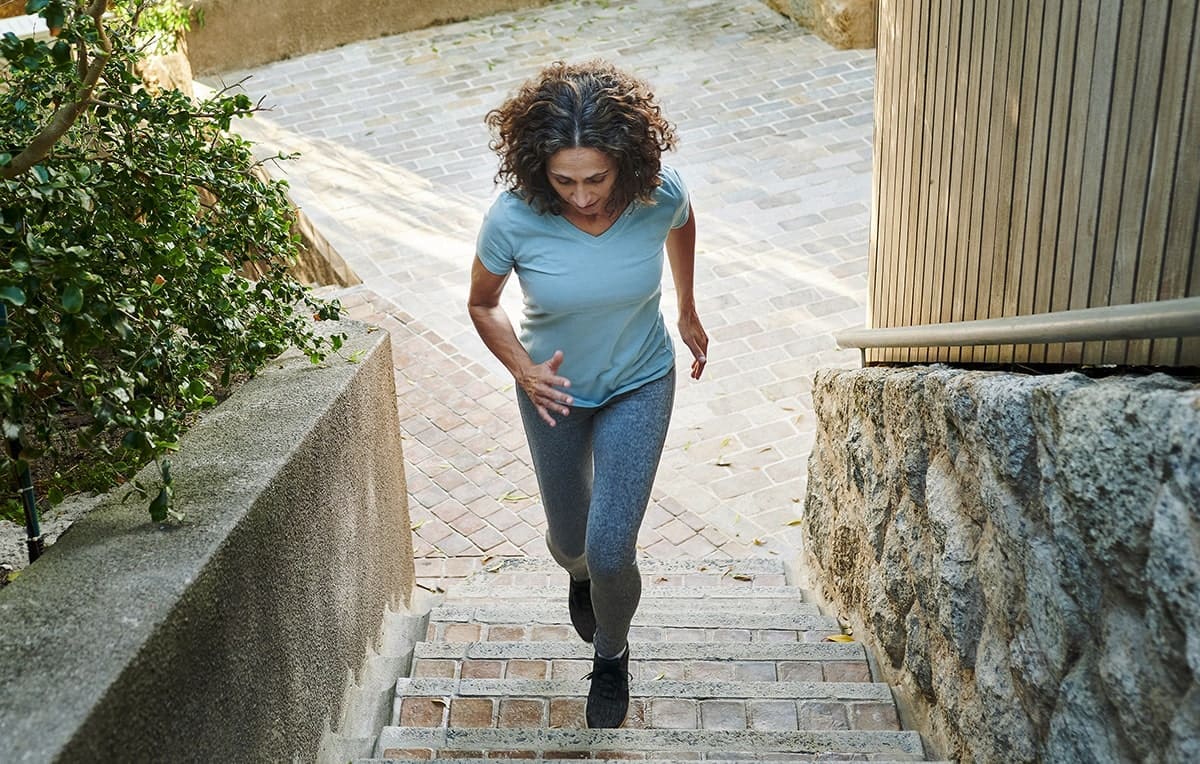 woman running up strairs