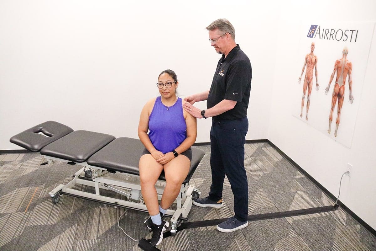 Patient getting treated for rotator cuff injury at Airrosti
